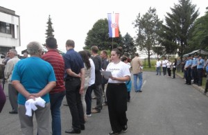 The protesters distributed leaflets during minister's speech.